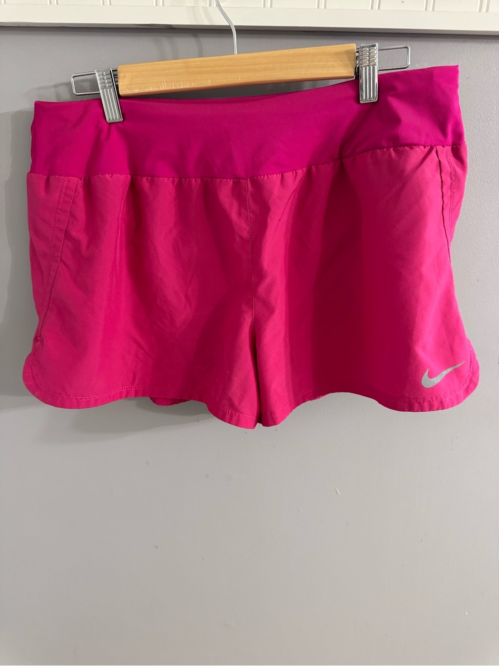 Nike Women's Bright Pink Athletic Shorts with Reflective Swoosh